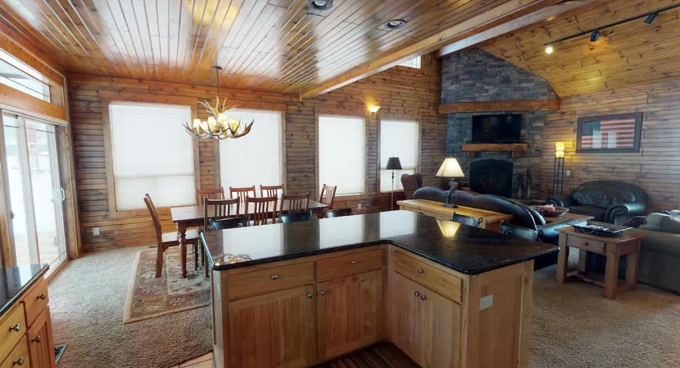 From the kitchen there is a large view of the dining room and the large windows.