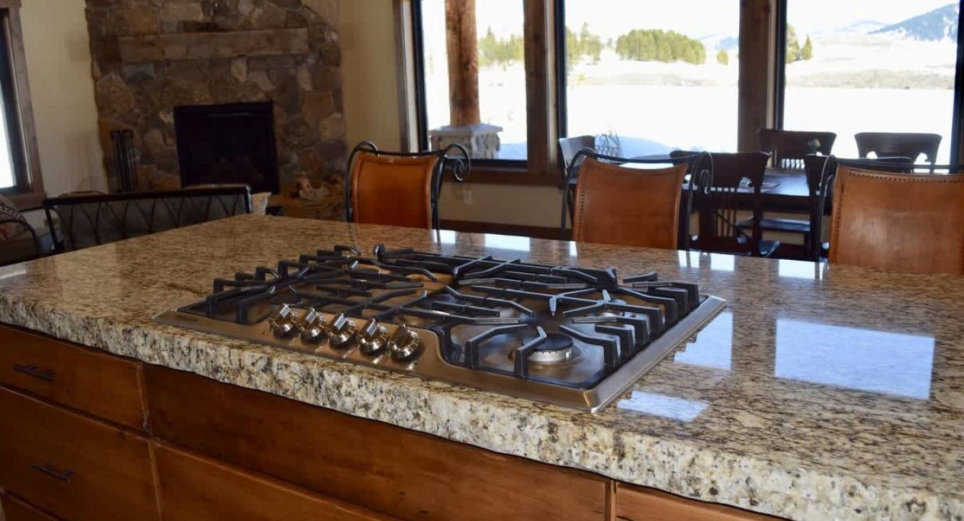 Seating available at the kitchen island as well as the dining table.