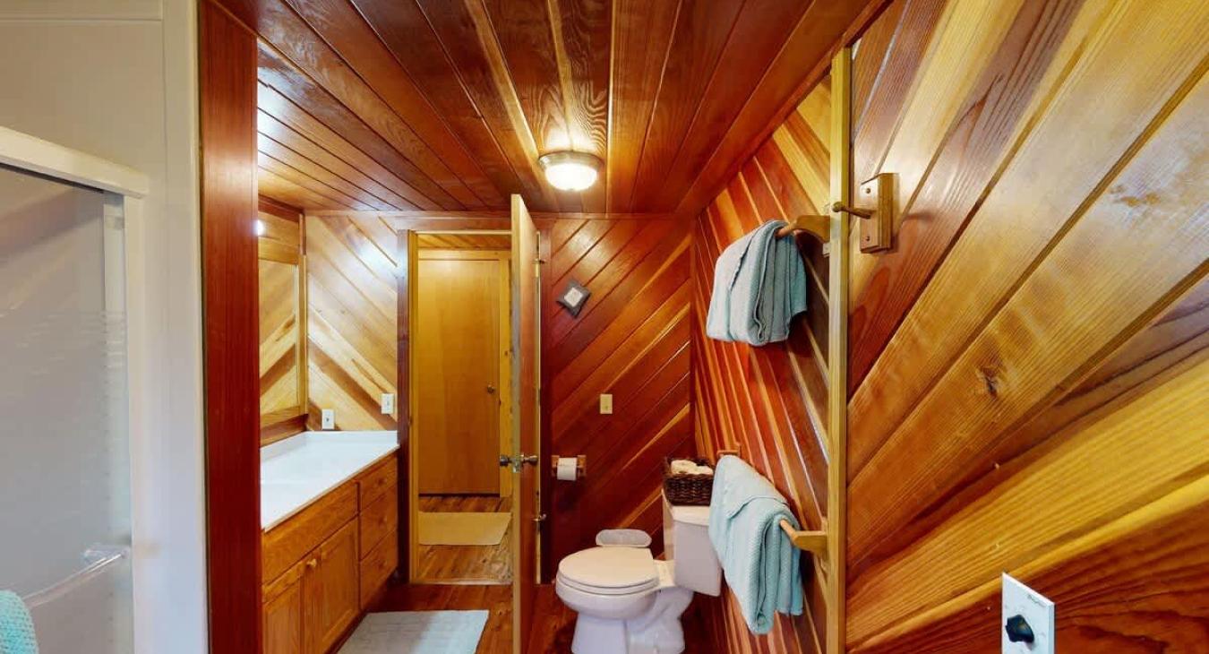 Main level bathroom #2 with shower/tub, toilet, and sink vanity.