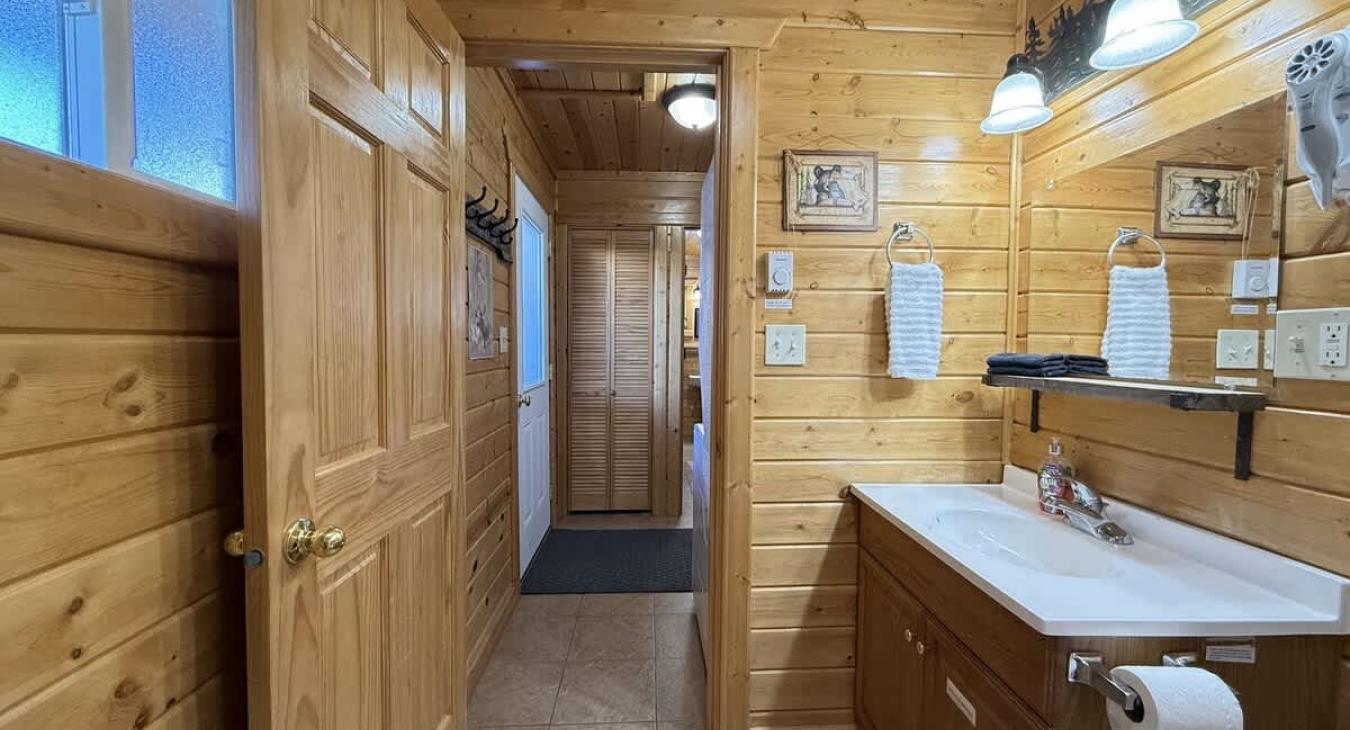 A cabin bathroom feels like a little retreat within a retreat—warm, earthy, and connected to nature in the most calming way.