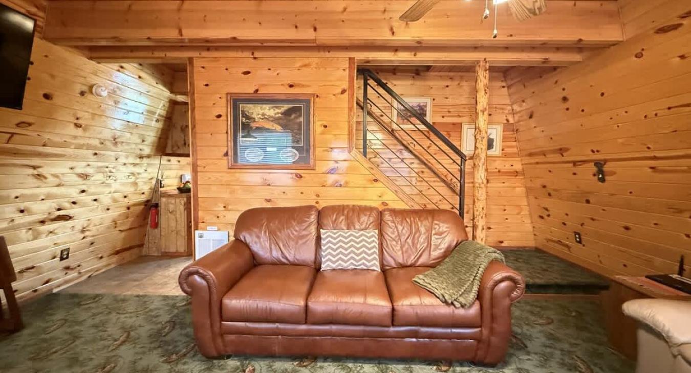 living room couch with view of the stairs.