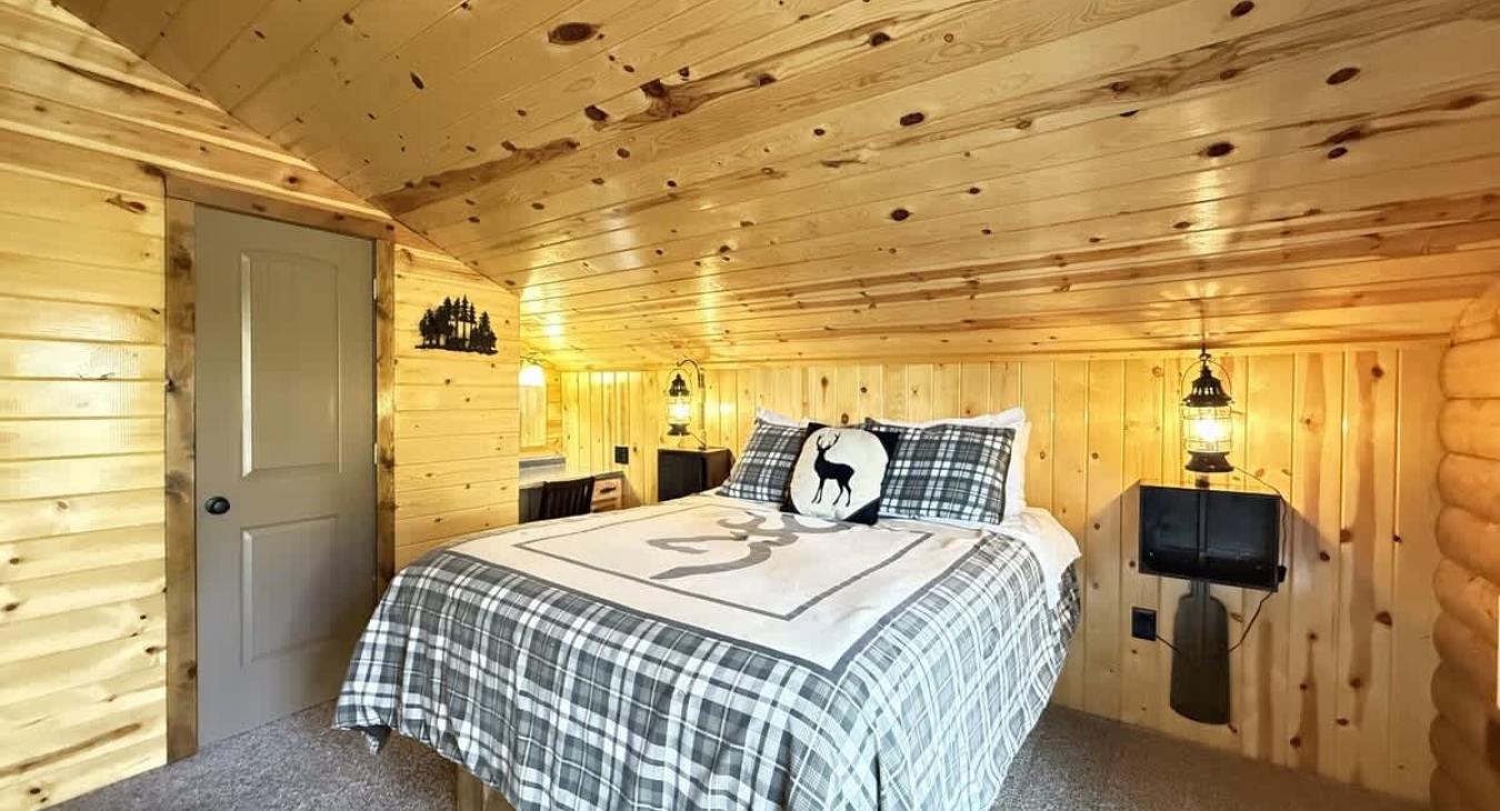 Bedroom #2 upstairs with a Queen size bed. A closet is located in this room to store your belongings.