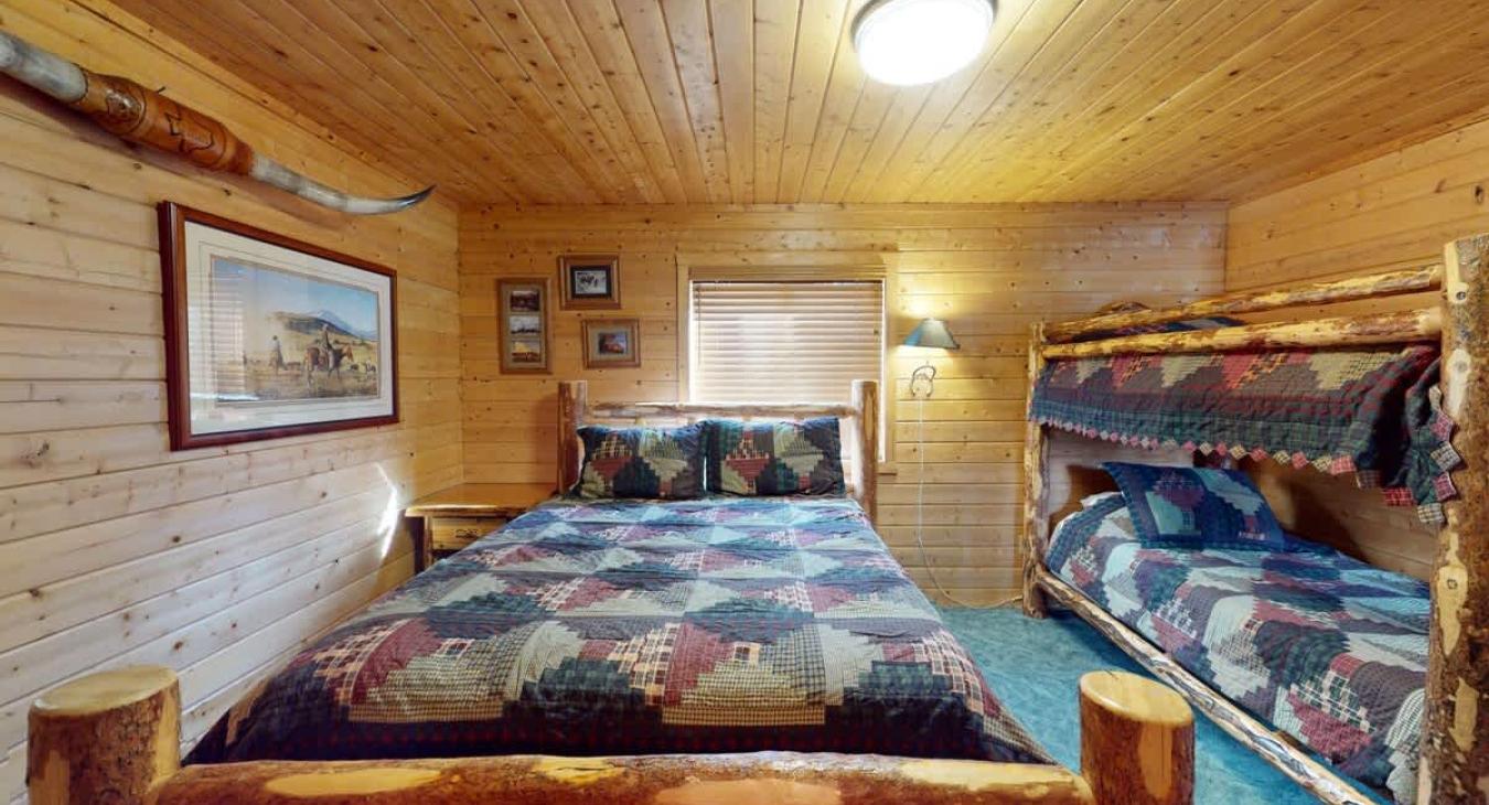 Bedroom #3 located upstairs with a Queen and a twin bed.