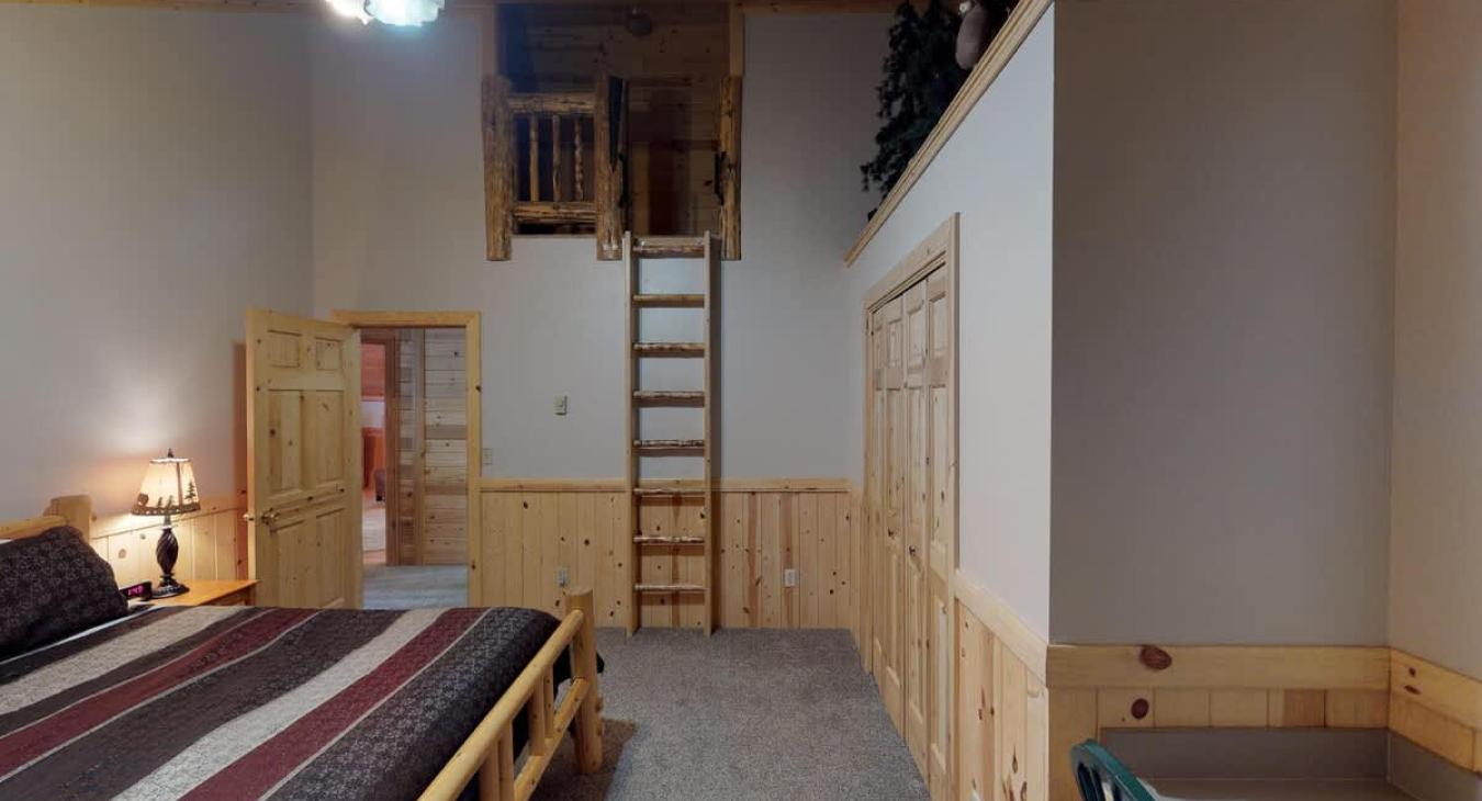 Bedroom #6 located upstairs with a King size bed.