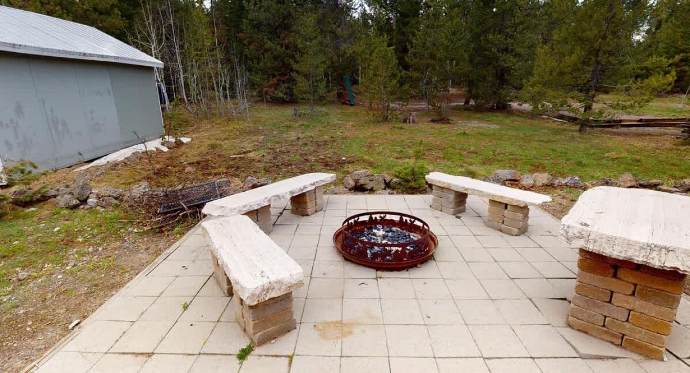 Fire pit located outside with seating. Make sure to bring your own firewood.