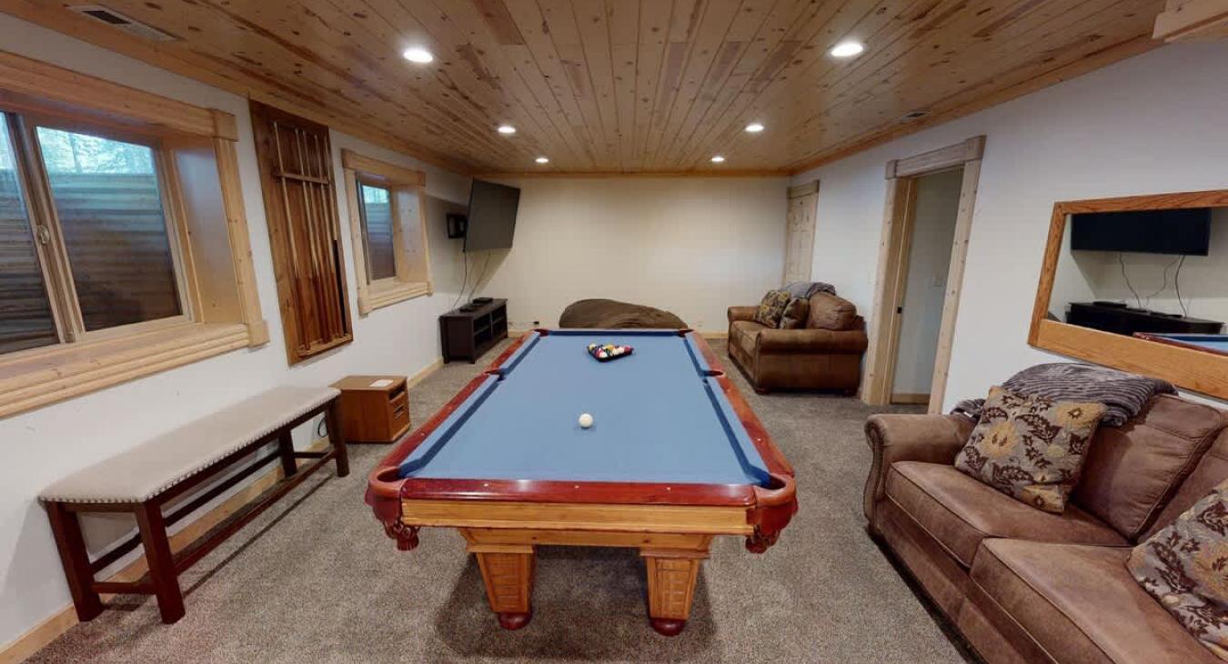 Basement Living area with a Pool Table.