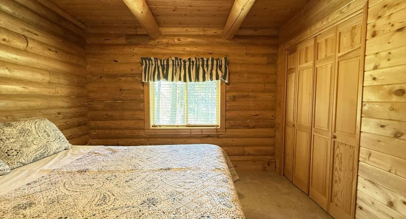 Bedroom #2 located on the main floor with a Queen size bed.