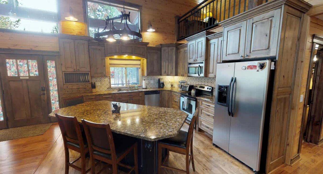 A full size kitchen with appliances, cookware, dishes, utensils, and everything you might need to cook a home cooked meal. Just bring your own food.