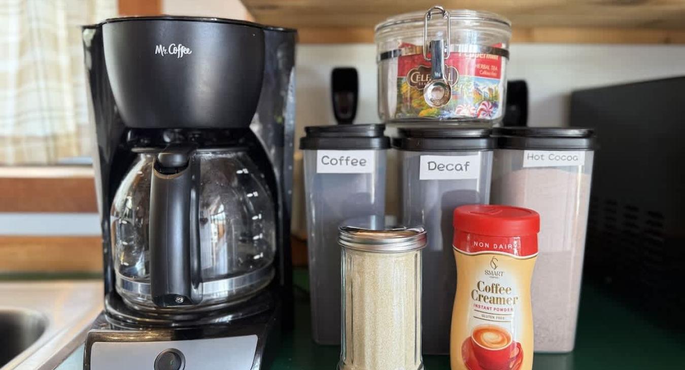 This cozy kitchen has the necessities needed for making a small meal or brewing up a cup of coffee.