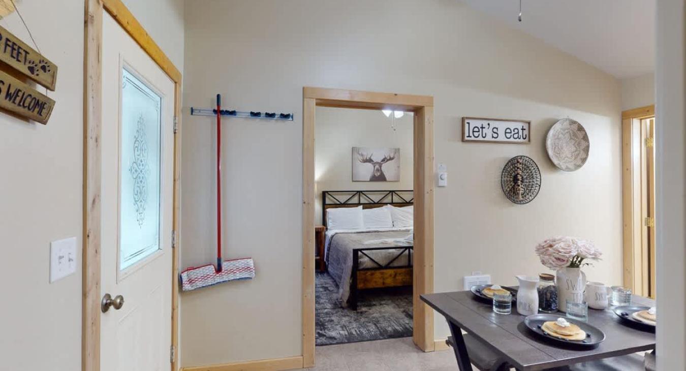 Outside of the bedroom is the main living area and kitchen.