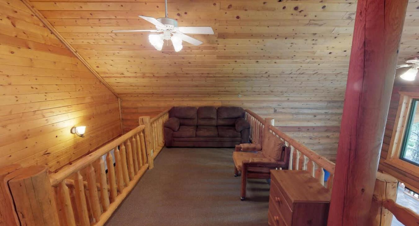 Upstairs loft with seating.