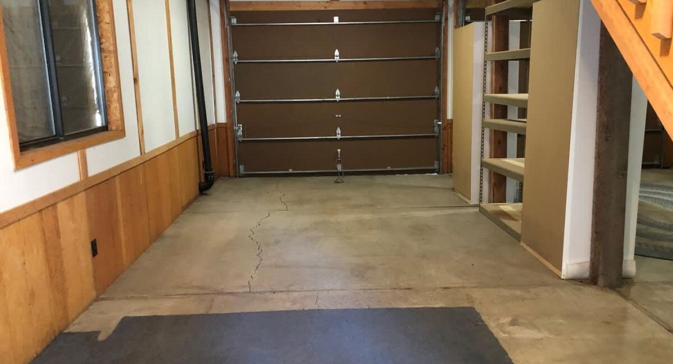 Open garage area below the cabin.