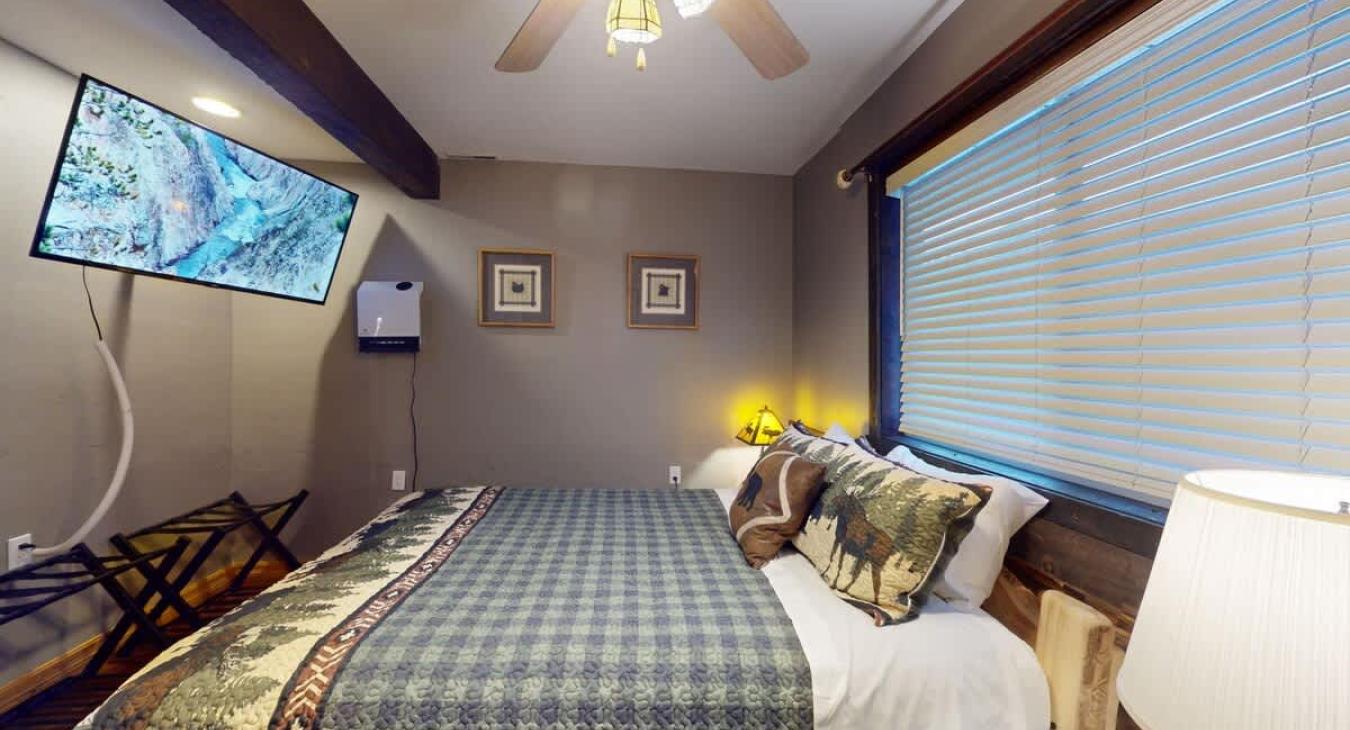 Relax after a long day outdoors in this relaxing bedroom.