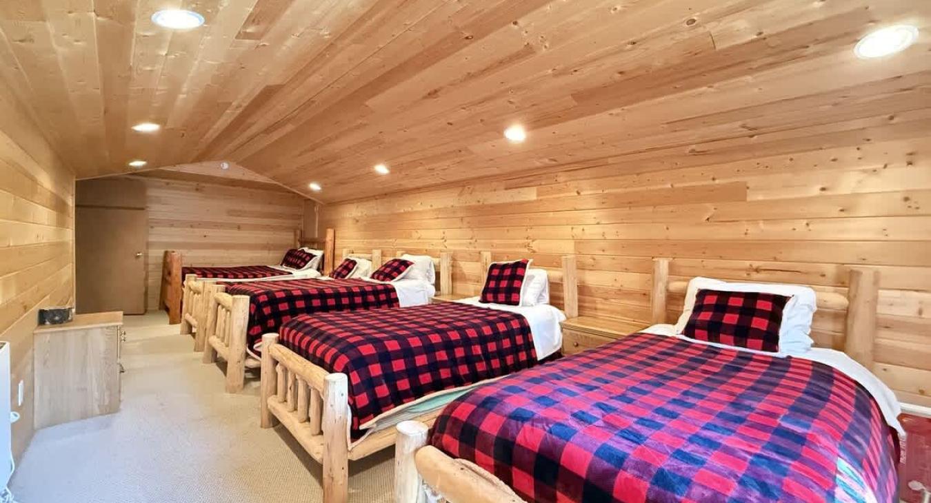 Kids bedroom with 3 twins and 1 full.