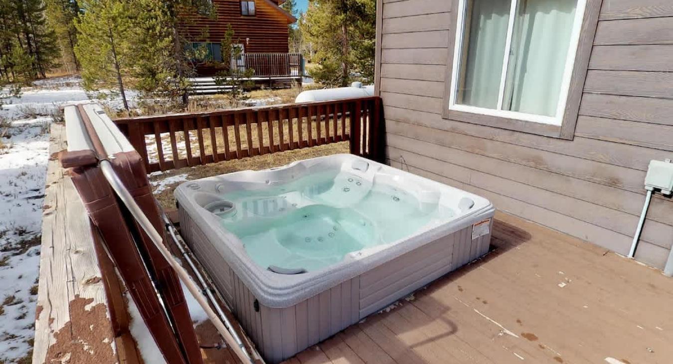 Hot tub located on the back deck perfect to unwind during your stay.