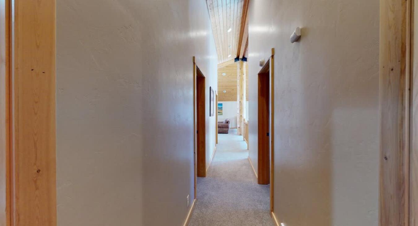 Hallway upstairs to access each bedroom.