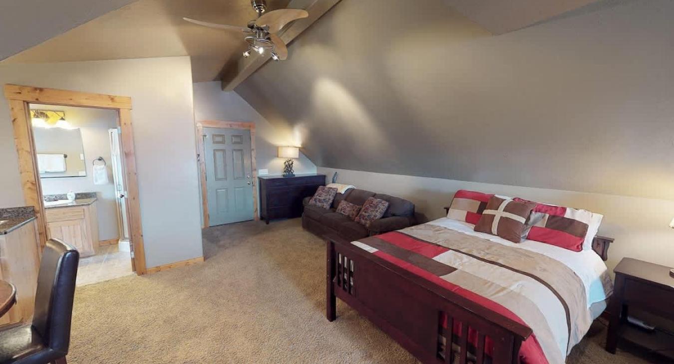 Beside the beds is a couch for seating others.