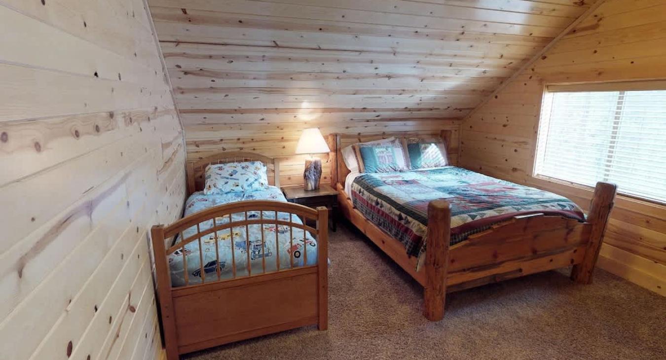 Bedroom #3 located upstairs with a Single and a Queen. Perfect for up to 3 people.