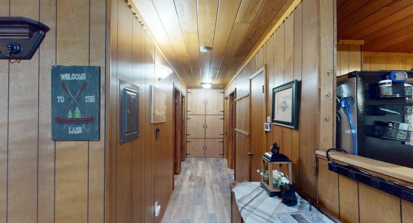 Large hallway to access both bedrooms and the bathroom.