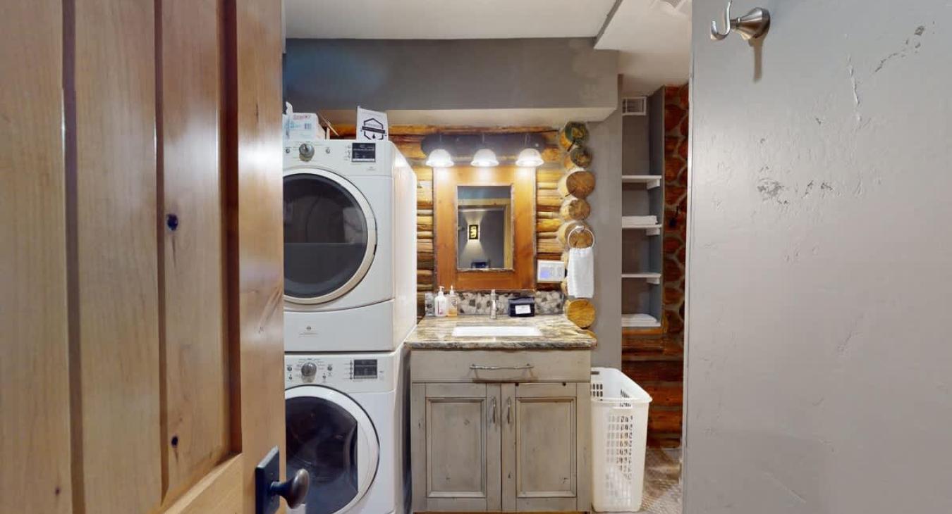 Full size washer and dryer with laundry soap provided.