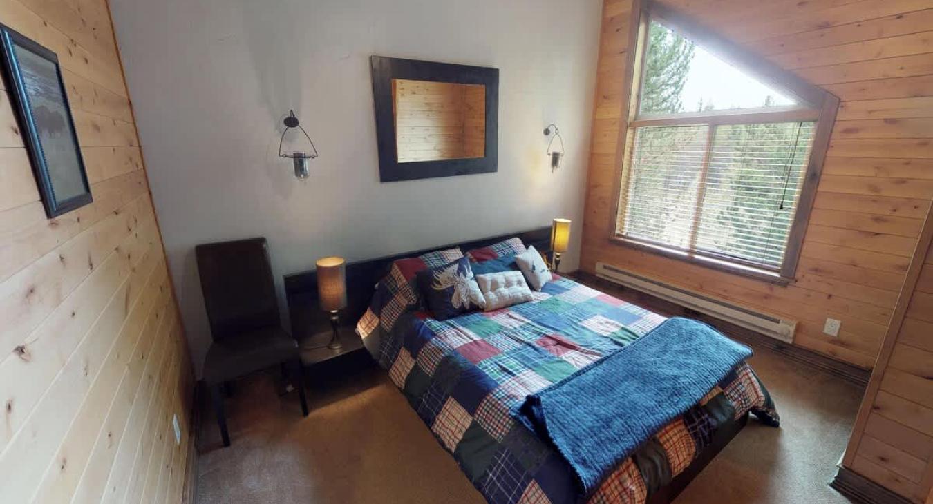 Bedroom #3 located upstairs on the second level with a Queen size bed.