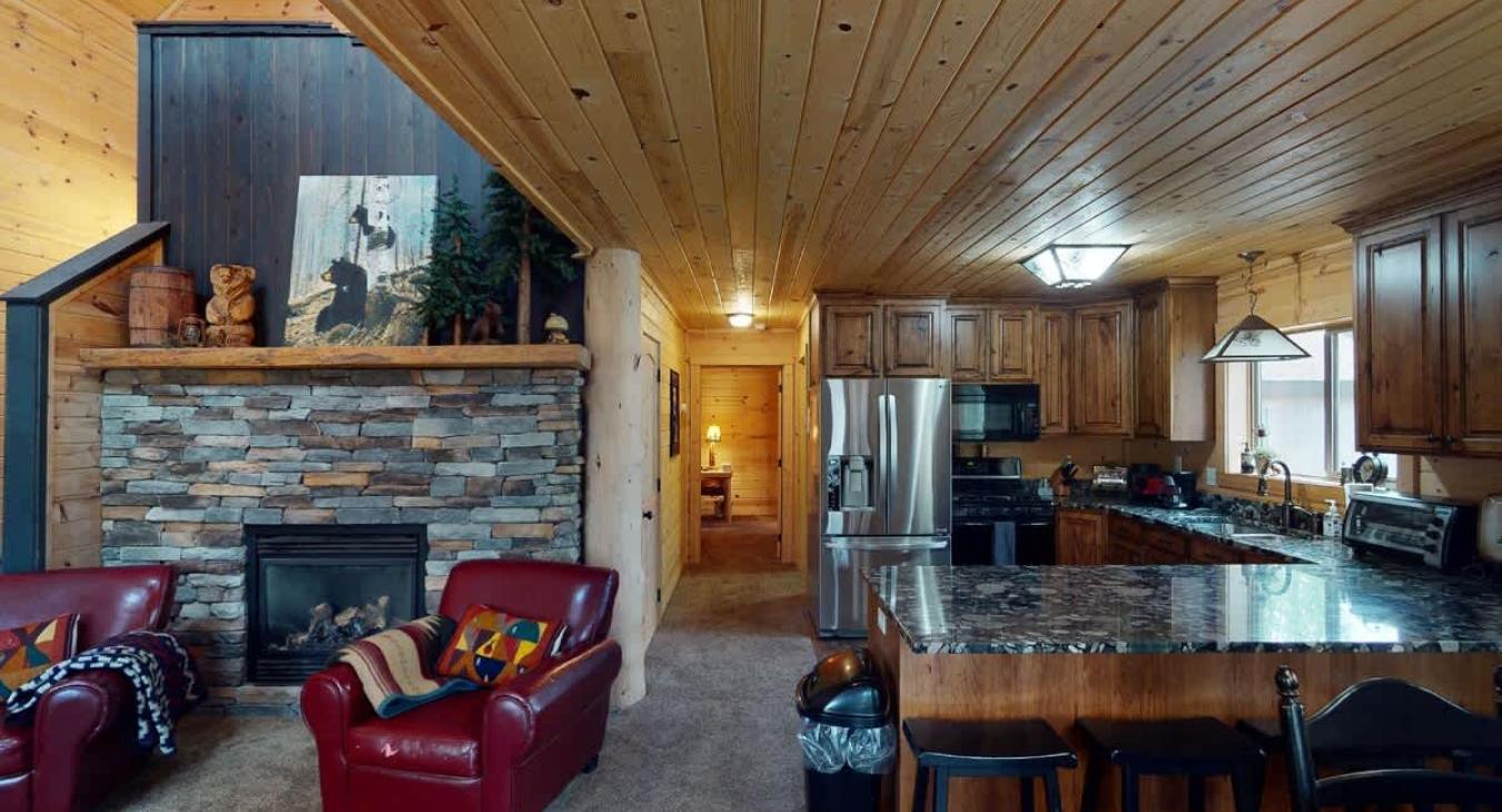 The living room is adjacent to the kitchen.