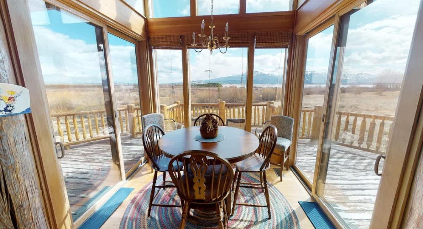 Dining table with seating for up to  4 people with 2 seats in the corner as well.