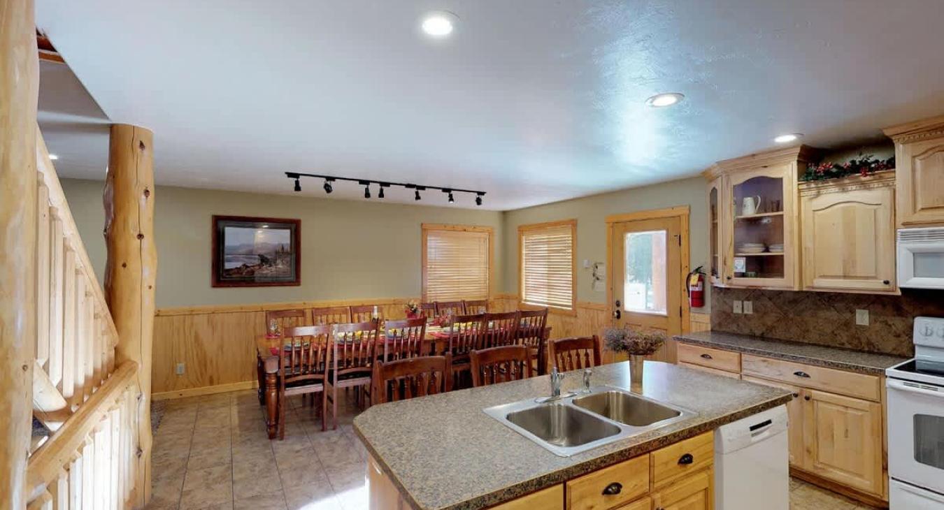 Upon entrance you are greeted by the dining room area and kitchen.