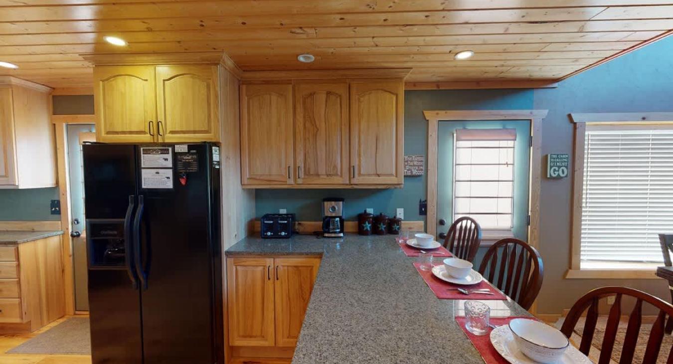 Full size kitchen with appliances, cookware, dishes, utensils, and basic cooking essentials.