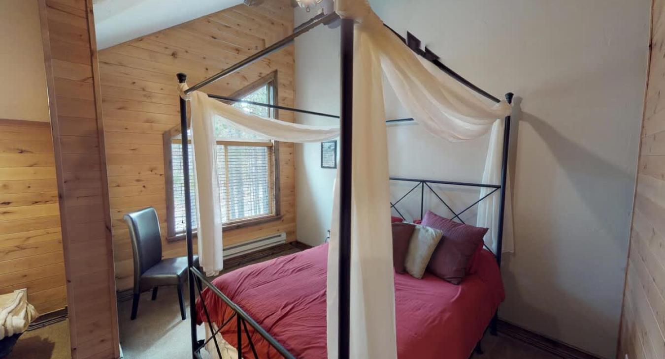 Bedroom #2 located upstairs with a Queen size bed in the room.