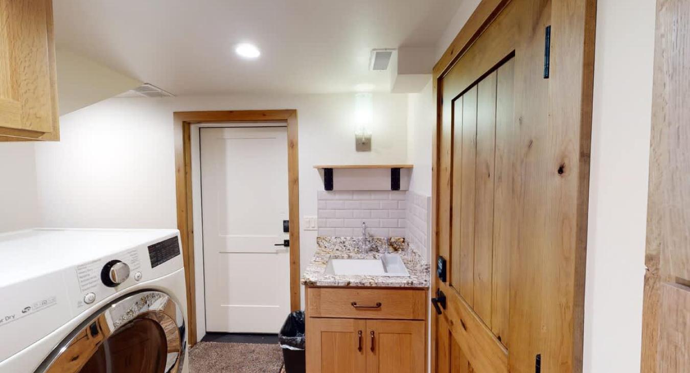 The laundry area is shared with the Yellowstone Days unit.