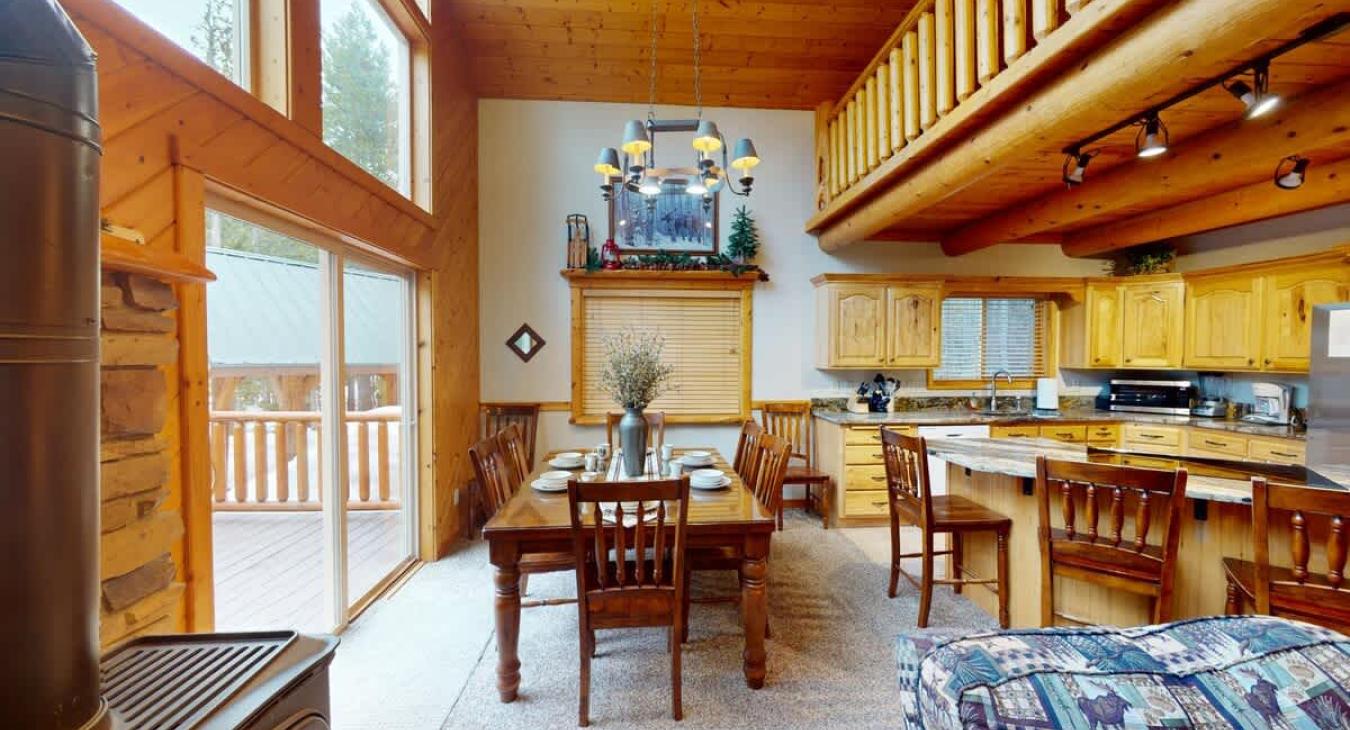 The dining table seats up to 6 with 4 additional seats at the kitchen island.