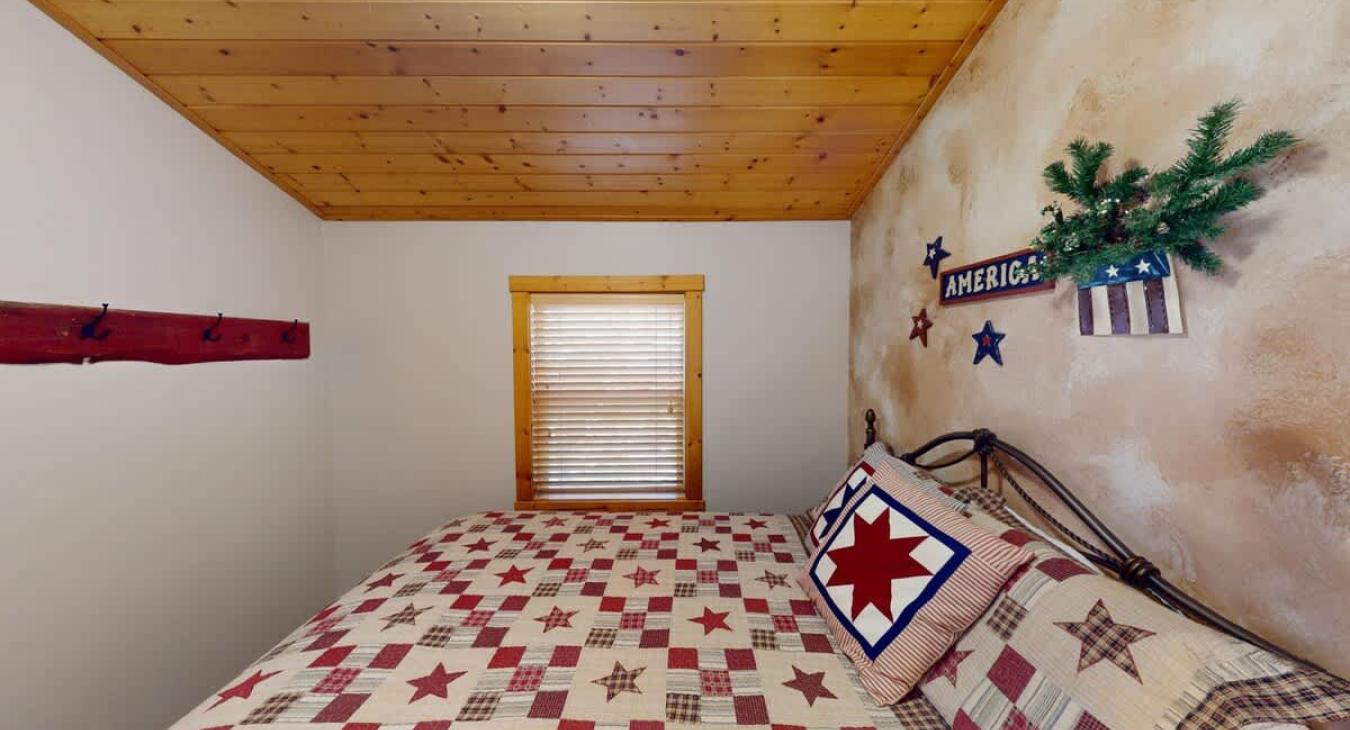 Bedroom #3 located upstairs with a Queen size bed.