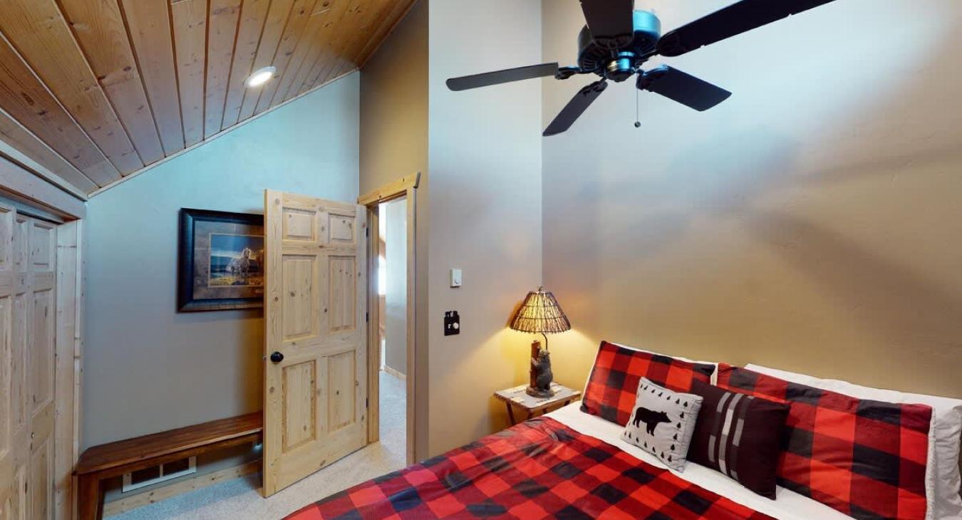 Large open bedroom that brings in lots of natural light.