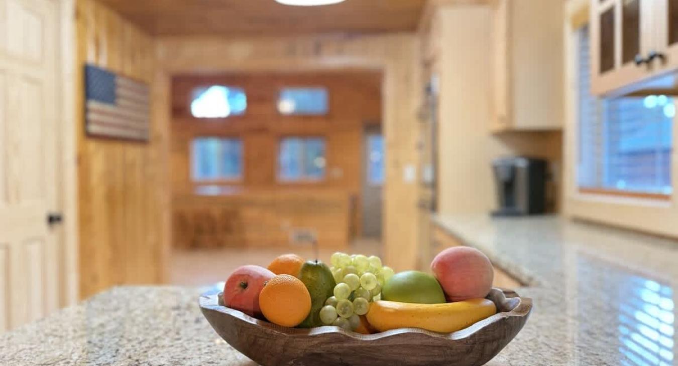A fruit bowl 0n the counter for those quick to go snacks.