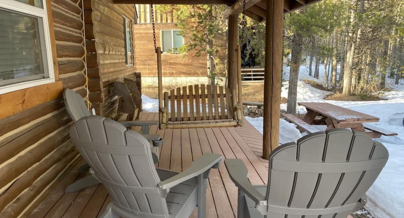 Patio with seating to enjoy the serenity of the cabin.