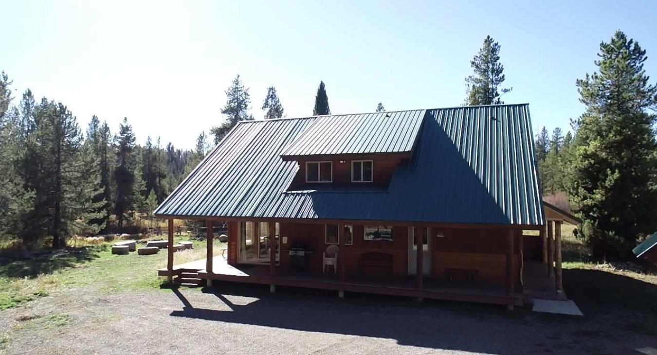 view of the fire pit in front of the cabin.