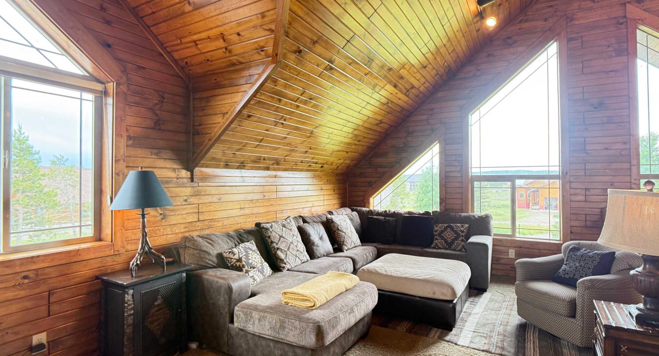 Relax on the plush loft seating surrounded by unique geometric windows that flood the entire upper floor with breathtaking natural light.