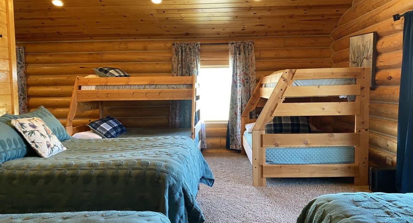 The overall design of the room balances functionality with comfort, with each area of the room offering a sense of privacy while still maintaining an open, communal feel.