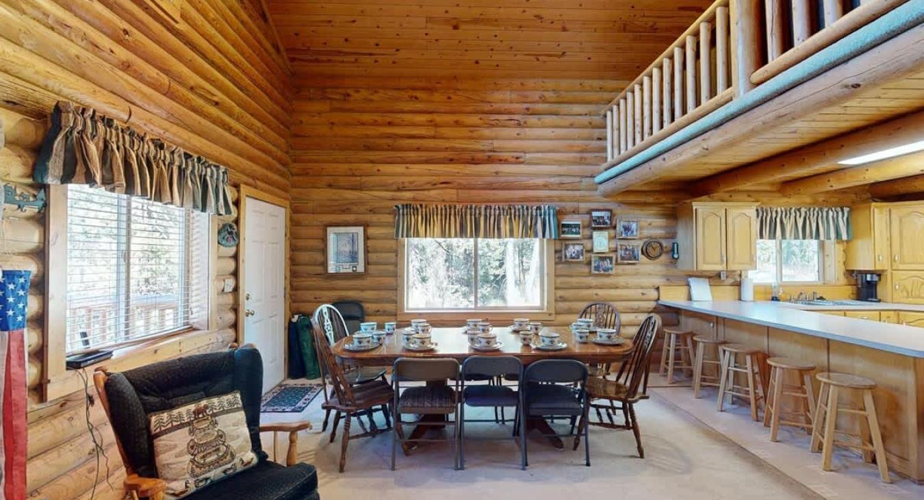 Dining room area seats up to 10 people with additional seating at the kitchen island.