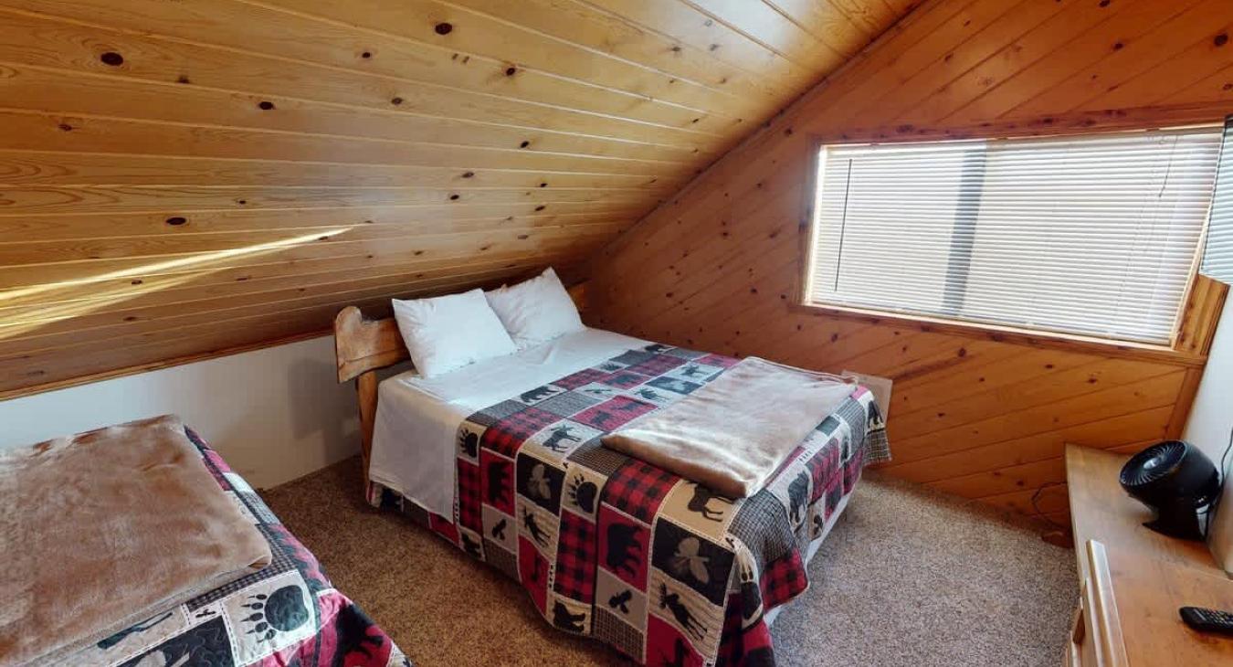 This room has a large window that lets in natural light during the day.