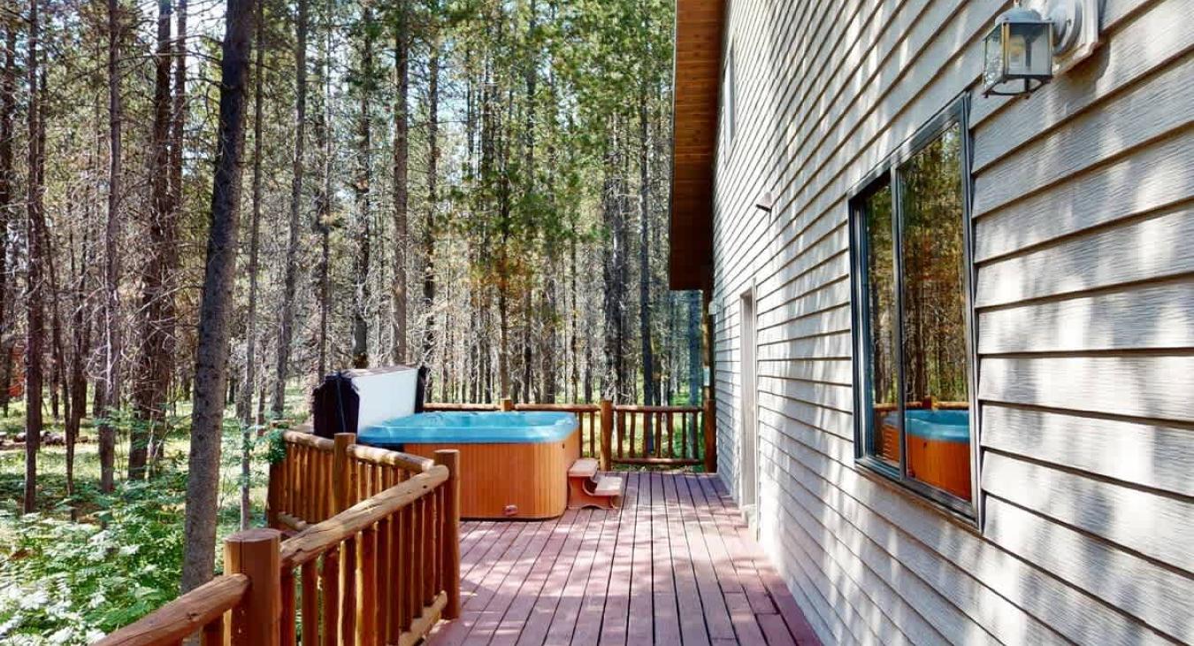 Deck with hot tub for you to enjoy.
