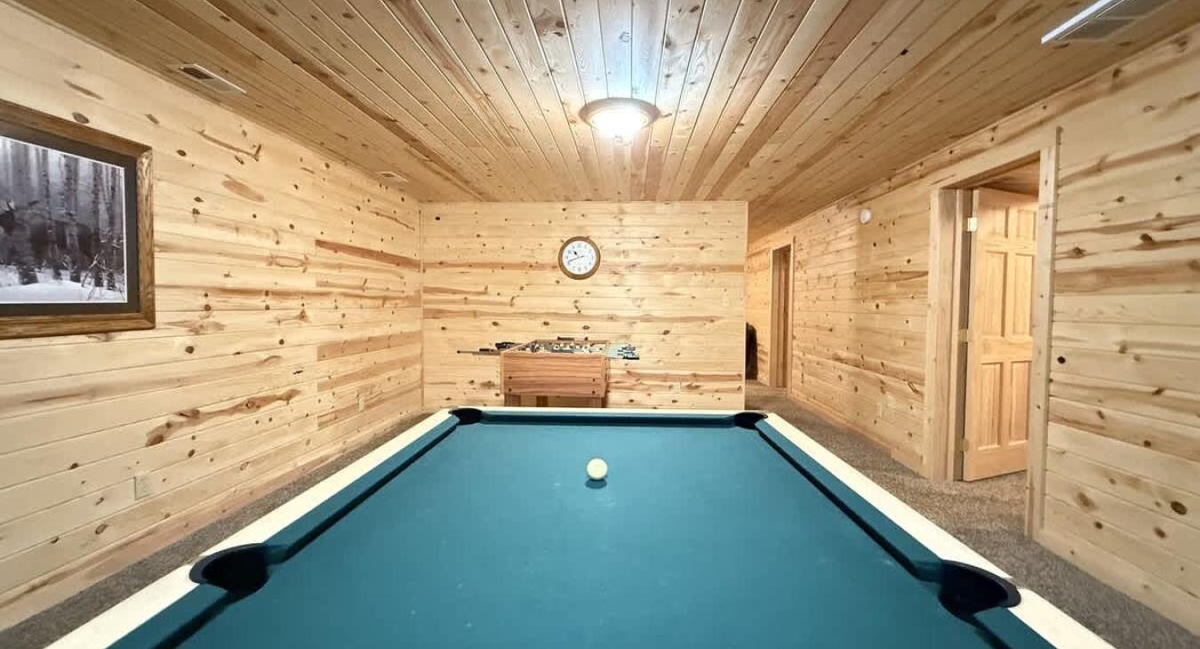 Game room with a Pool table for some friendly competition.