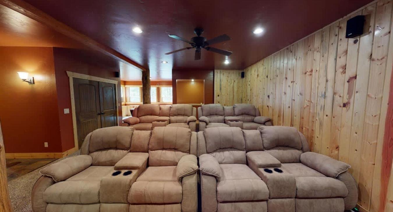 Basement living room with seating.