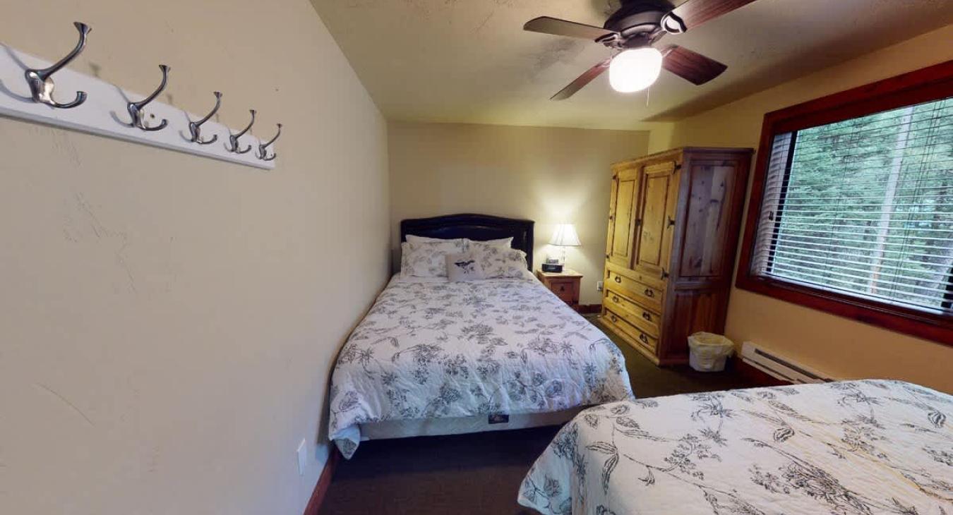 The master bedroom features 2 queen beds.