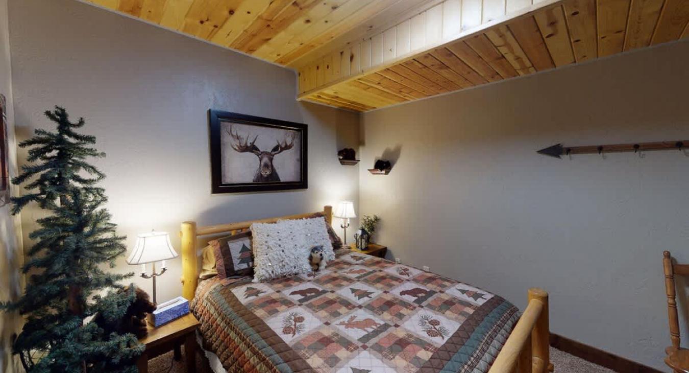 Bedroom #3 downstairs with a Queen size bed.