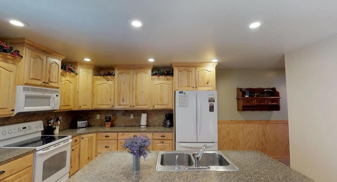 The openness of the kitchen makes it easy to chat with friends or family while cooking, or to catch the glow of the fire and the sound of laughter as you move between the rooms.