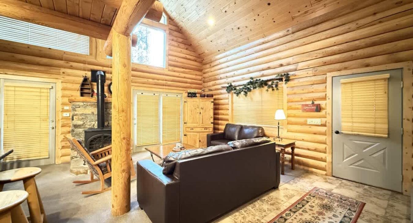 The living room with seating and tv for entertainment.