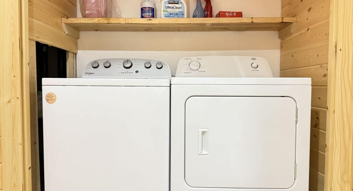 Full size washer and dryer with laundry soap provided.