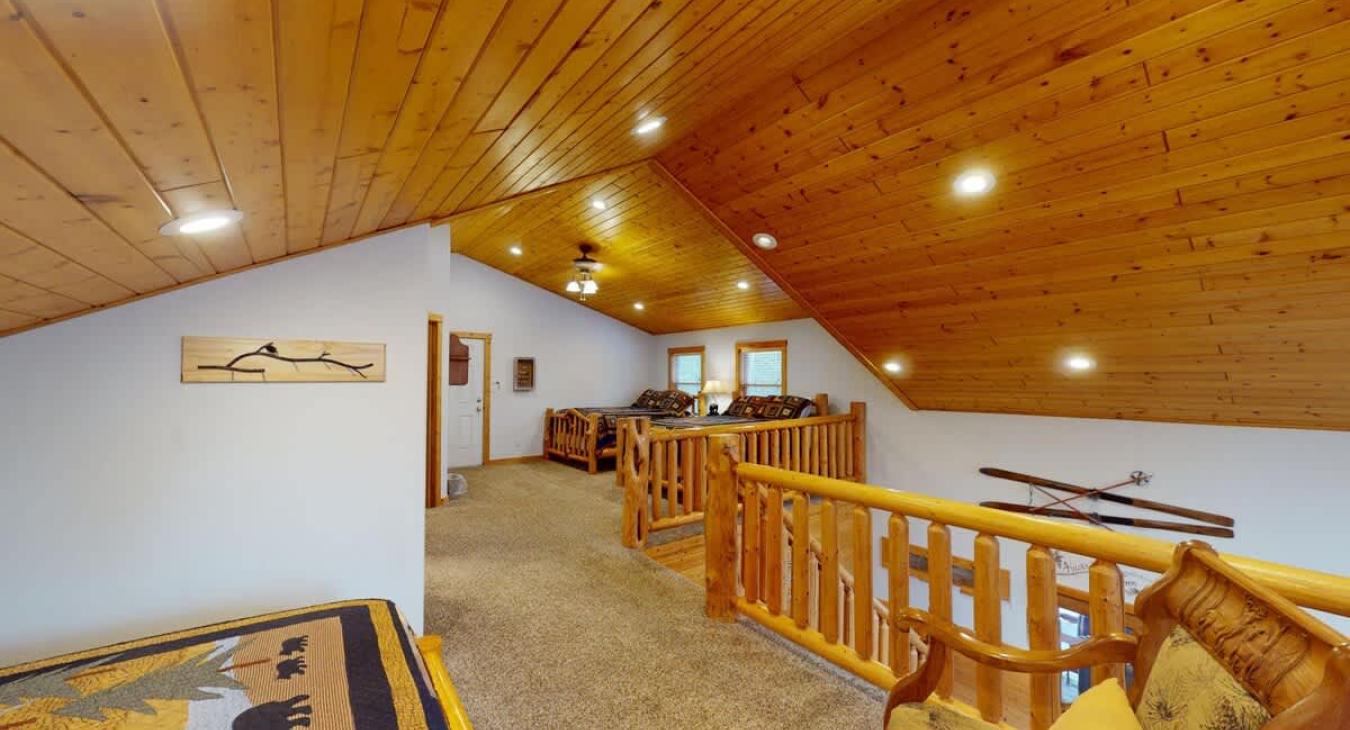 More beds are located on the other side of the loft.